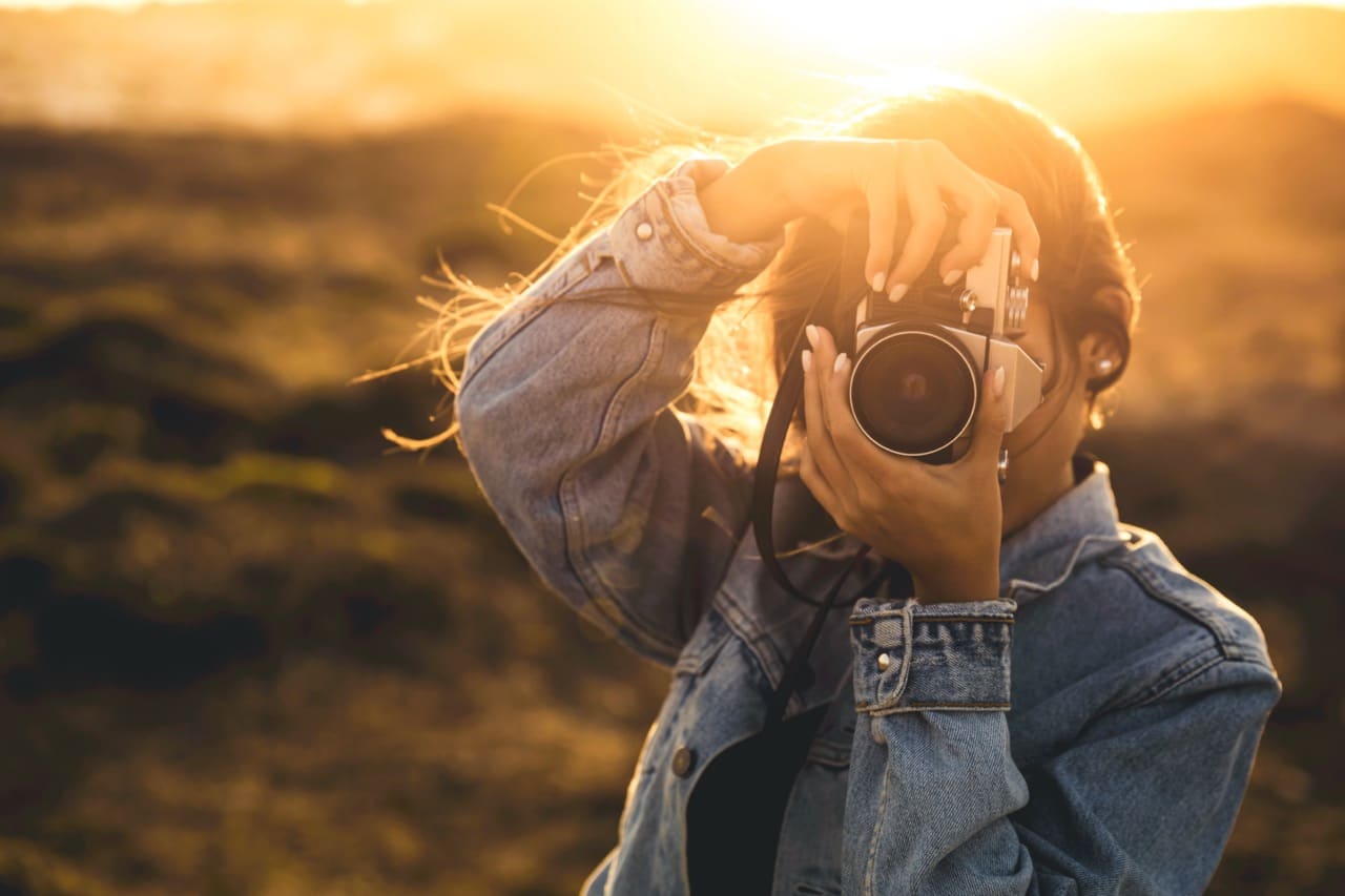 woman taking picture with camera