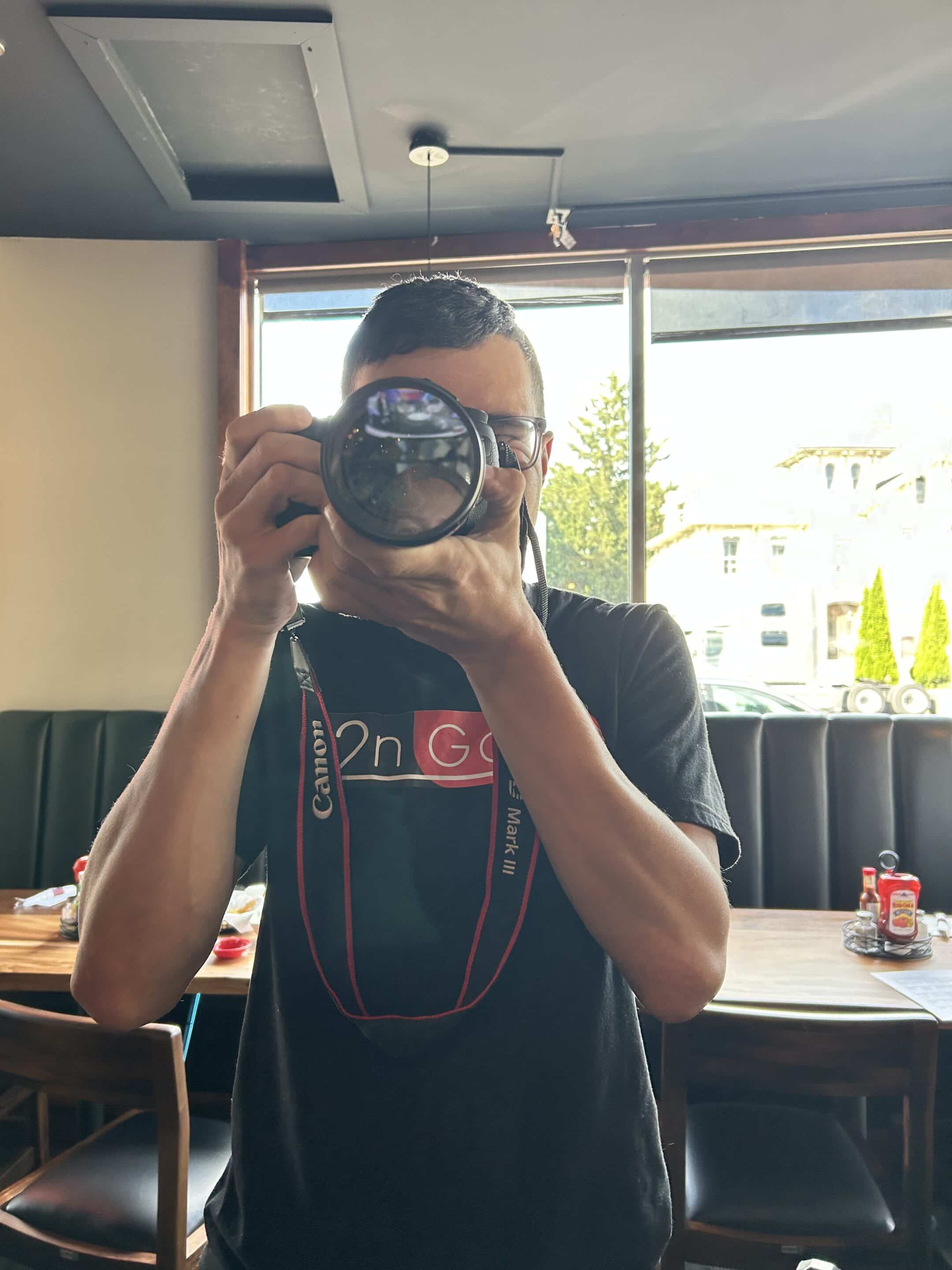 woman taking picture with camera