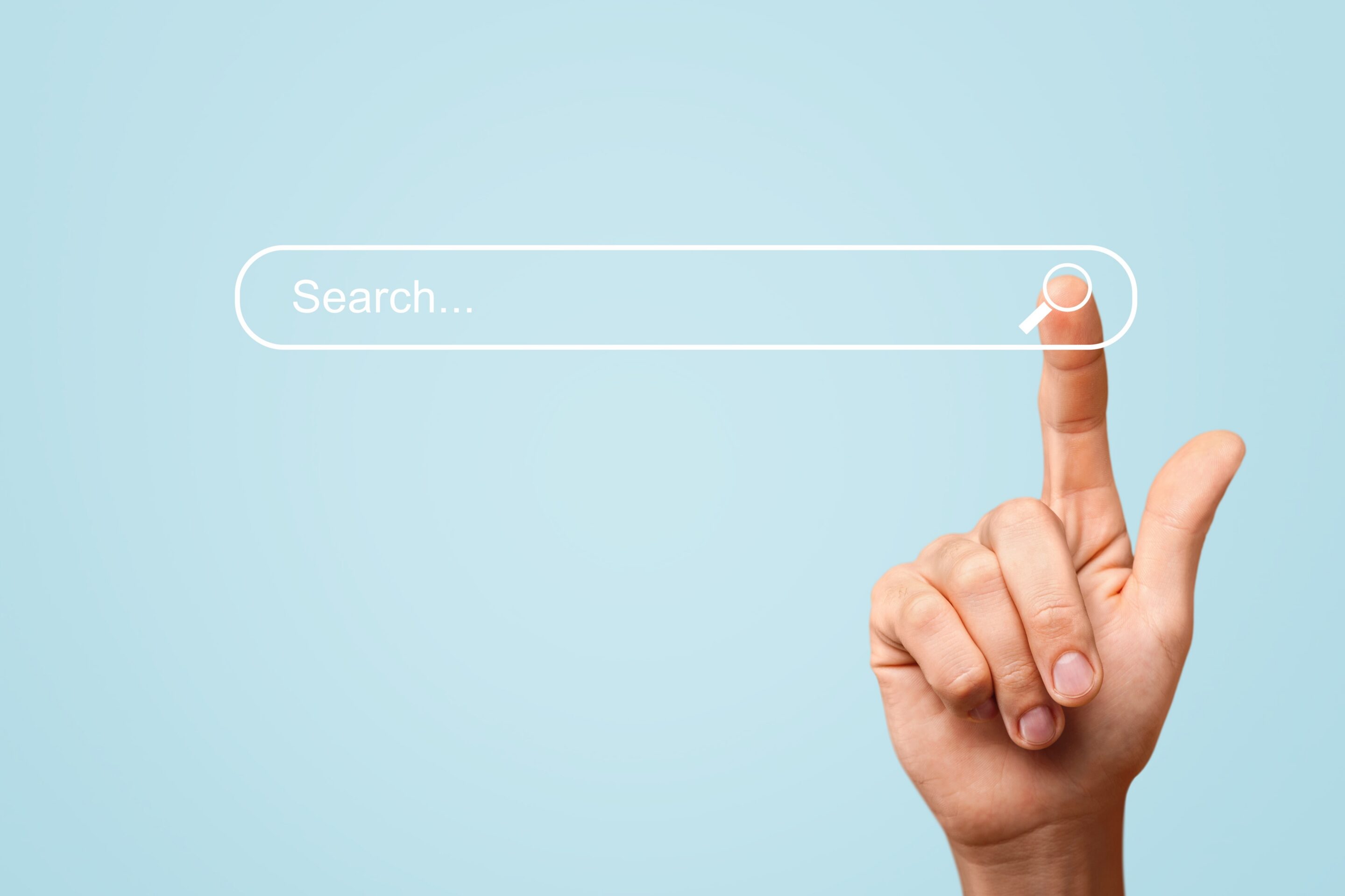 hand on search bar. SEO concept